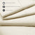 A set of beige PureCare Luxury Microfiber sheets that are machine washable.